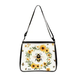 White canvas tote bag featuring sunflower and bee print with adjustable black strap