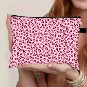 Pink leopard print cosmetic bag with heart patterns and black zipper closure