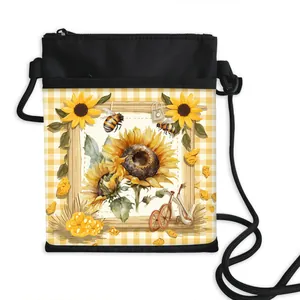 Mini crossbody phone bag with sunflower and bee illustration on yellow checkered base