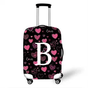 Elastic luggage protector with pink heart patterns and letter B print on black fabric