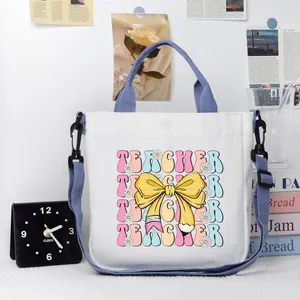 Borsa tote insegnante in tela bianca con spallacci viola e stampa grafica floreale