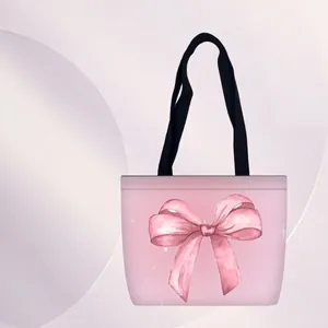Sac fourre-tout rose en toile avec imprimé nœud géant et bandoulières noires