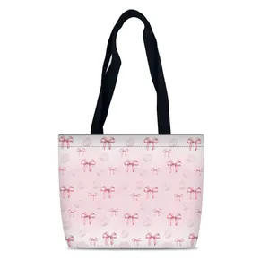 Sac fourre-tout en toile rose avec motifs nœuds et lèvres et grandes anses noires