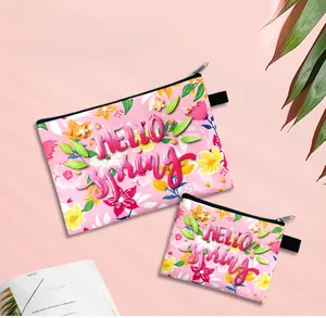 Detail of pink floral zipper pouches with HELLO spring print for coins and cards