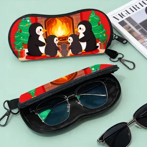 Detail of Christmas penguin print glasses case with zipper closure and metal carabiner hook