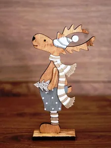 Close-up of a wooden reindeer ornament with striped scarf and hat for Christmas decor