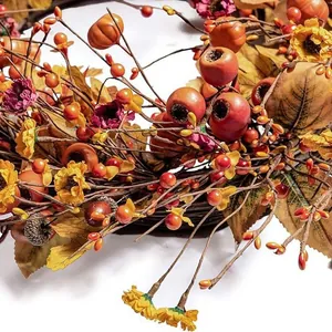 Autumn wreath with pumpkins sunflowers and berries for Halloween and Thanksgiving home decor