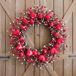 Valentine's Day heart wreath with red berries on a rustic wooden door background