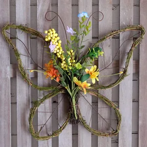 Pastoral style straw butterfly door hanging with colorful artificial flowers and moss
