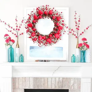 Red heart-shaped Valentine's Day wreath on a fireplace mantel for home decoration