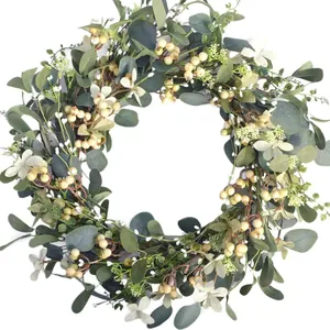 Eucalyptus and white berry wreath on natural rattan for Easter or Christmas home decoration