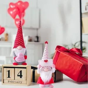 Handmade Valentine's Day gnomes with heart patterns and love letter for festive decor