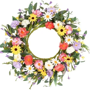 Couronne de fleurs sauvages artificielles avec marguerites colorées sur fond blanc