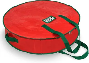 Detail van rode kerstkrans opbergtas van 24 inch met groene handgrepen en kaartgleuf