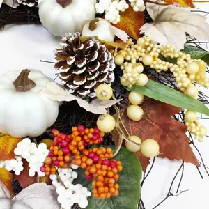 Autumn wreath with white pumpkins, pine cones, and colorful berries on a white background