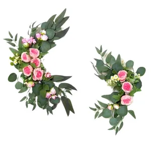 Detail of pink silk roses and eucalyptus leaves for wedding arch and door decorations