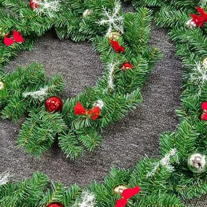 5m Christmas pine garland with red bows, colorful baubles, and snowflake decorations
