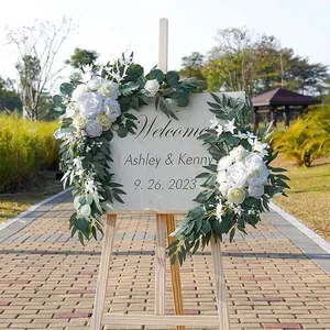 Wedding welcome sign decor set featuring artificial white roses and eucalyptus leaves