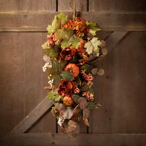 Fall harvest hanging door swag with peonies, sunflowers, pumpkins and maple leaves