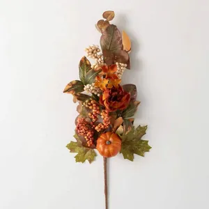 Autumn floral arrangement with pumpkins, sunflowers and maple leaves on white background