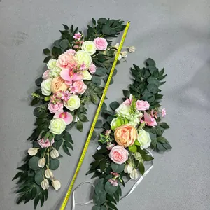 Detail of 90cm artificial silk floral swag featuring pink roses and orchids for weddings