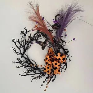 Halloween wreath with black twigs, purple feathers, orange polka dot bow and a wizard hat