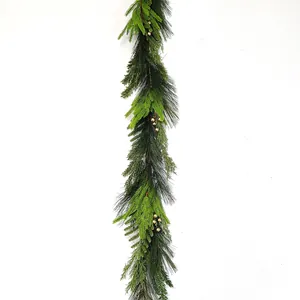 Detailed texture of green pine needles and berries on a Christmas garland decoration