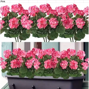 Pink artificial geranium flowers with green leaves in a black window planter box