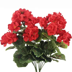 Artificial red geranium bouquet with vibrant silk flowers and patterned green leaves