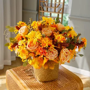 Artful autumn floral arrangement in a woven basket with roses, daisies and maple leaves