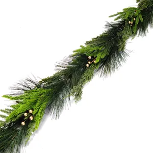 Close-up of Christmas garland featuring pine needles, cedar branches and gold berries