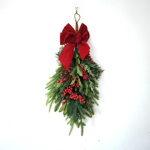 Christmas teardrop wreath with red bow, frosted pine needles and berries decor