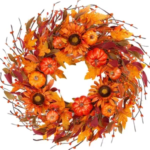 Fall wreath with orange sunflowers, pumpkins and maple leaves on a white background