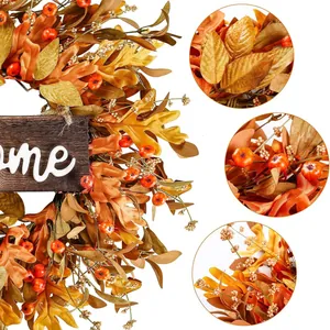 Ghirlanda autunnale con foglie di acero bacche e segno di benvenuto decorativo