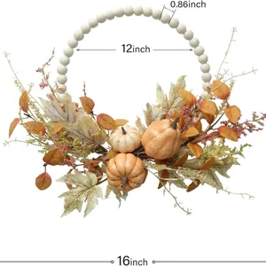 Fall wreath with wooden beads pumpkin and maple leaves measuring 16 inches for home decor