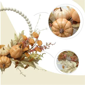 Fall wood bead pumpkin wreath with autumn berries and leaves for farmhouse wall decor