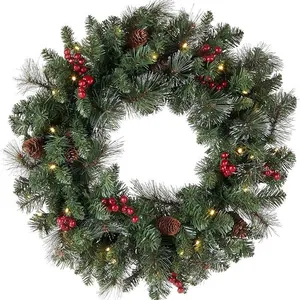 Christmas wreath with pine needles, red berries, cones and warm LED lights on white background