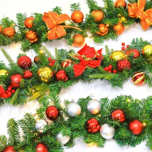 Detail of 2.7m Christmas garland with colorful balls, bows, berries and LED lights