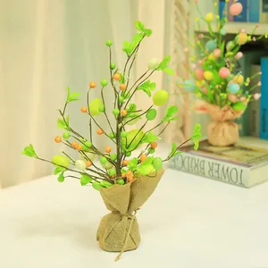 Easter decorative tree with colorful eggs and burlap base for festive tabletop home decor