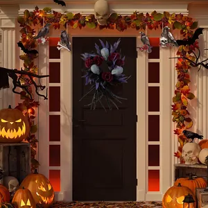 Gothic Halloween wreath with skulls, red roses and purple leaves on a black door background