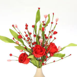 Detail of red artificial roses with pink heart berries for romantic home decor