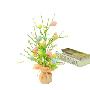 Easter egg tree centerpiece with colorful eggs and a rustic linen base for home decor