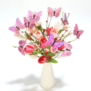 Artificial tulip bouquet with butterflies in a white ceramic vase for home decor