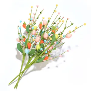 Branches de Pâques artificielles avec œufs colorés et carottes pour décor de fête