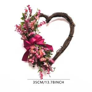 35cm heart-shaped vine wreath with pink floral clusters and red ribbon for front door decor