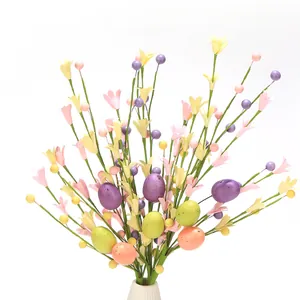 Detail of Easter artificial floral stem with speckled pastel eggs and small bell flowers