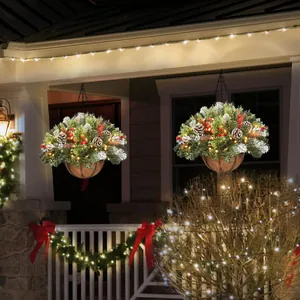 Hanging Christmas basket with pine needles, red berries and warm LED lights