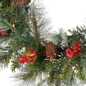 Christmas wreath with green pine needles, red berries, cones and warm LED lights on white