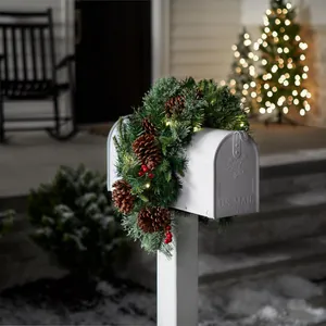 Christmas pine cone garland with LED lights on a classic white US Mail mailbox