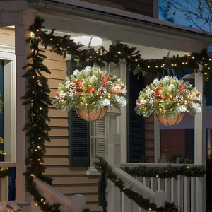 Christmas hanging basket with pine needles, pinecones, berries, and LED lights on a porch